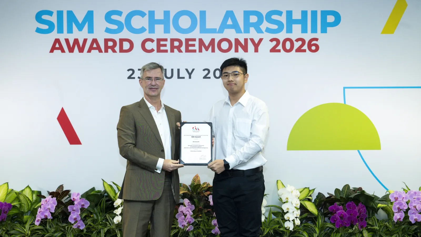 Receiving the SIM Scholarship at the SIM Scholarship Award Ceremony 2026